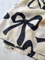 Sciarpa Bow – Maxi fiocchi, anima grafica